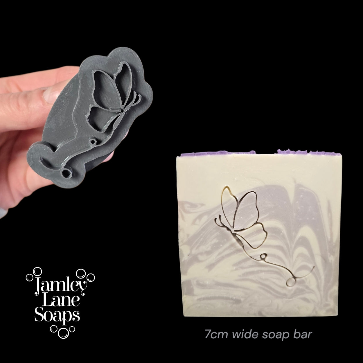 Butterfly-shaped stamp held by a hand with a soap bar featuring a butterfly design.