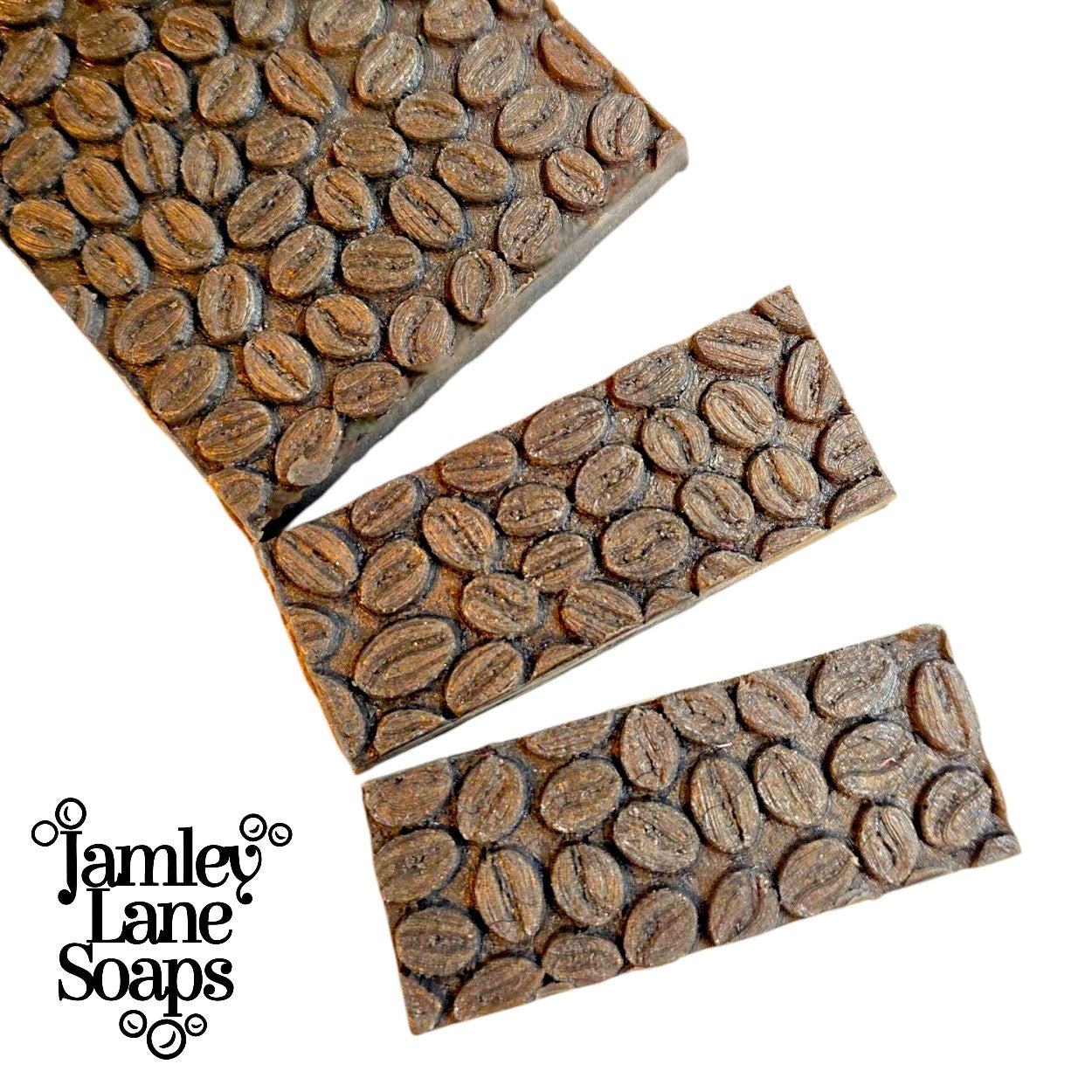 Three rectangular approx. 1" wide soap bar tops with a coffee bean pattern on a white background, featuring Jamley Lane Soaps branding.