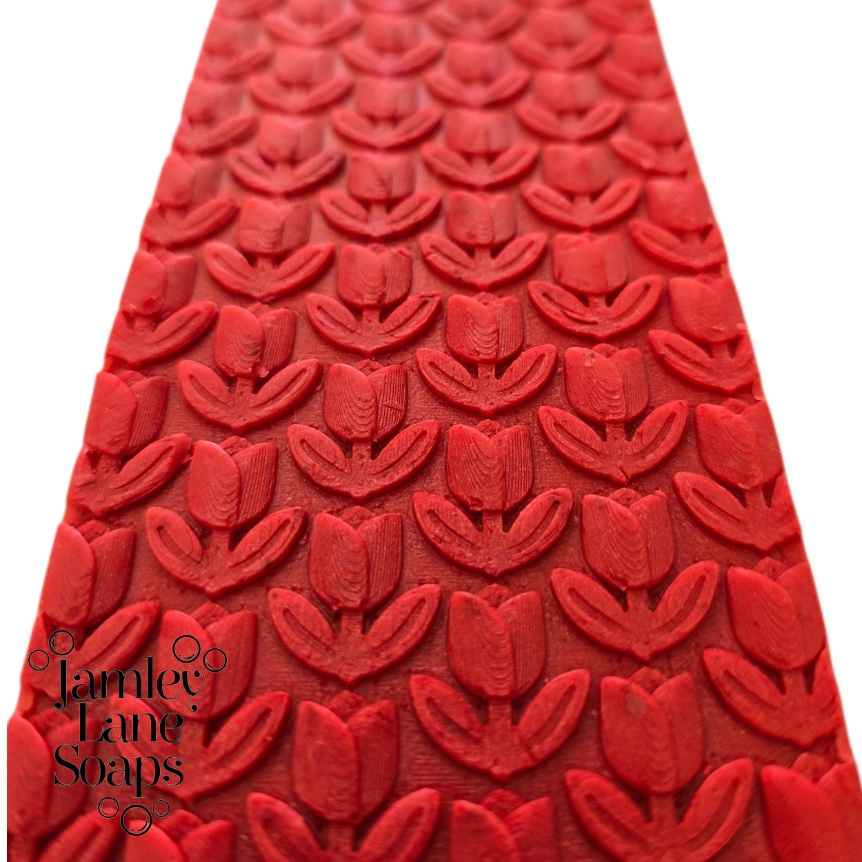 Red soap top with 3D repeating tulip pattern and 'Jamey Lane Soaps' logo on a white background