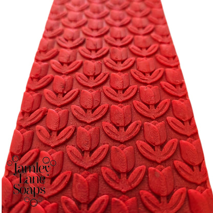 Red soap top with 3D repeating tulip pattern and 'Jamey Lane Soaps' logo on a white background