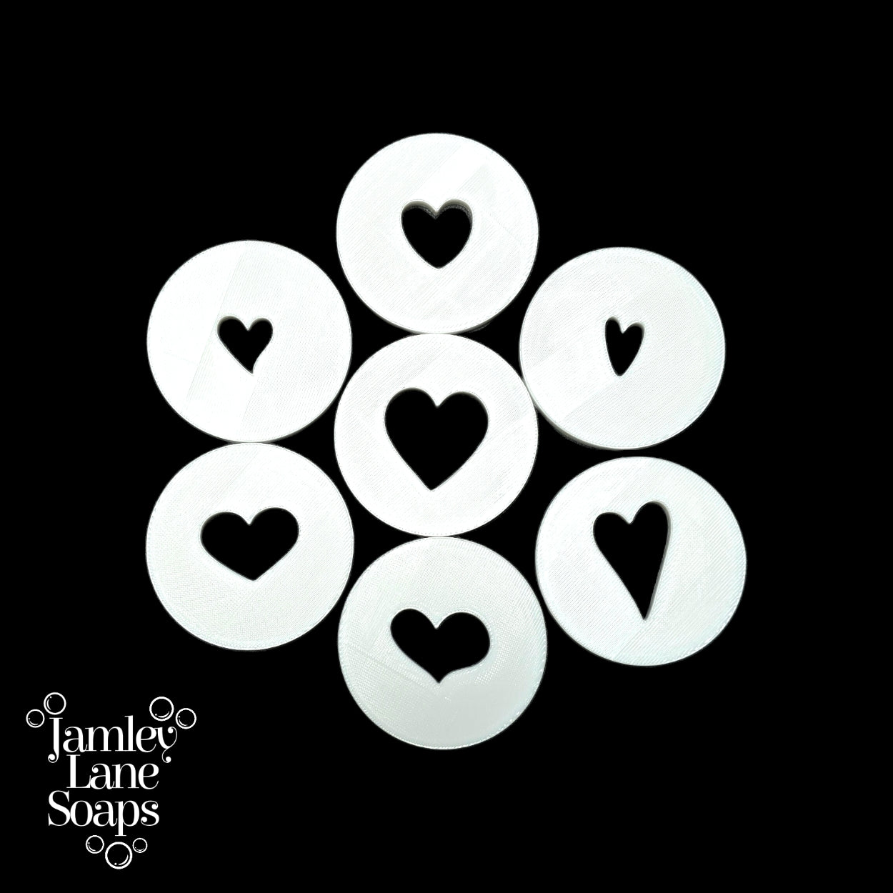 White heart-shaped discs arranged in a circular pattern on a black background, with 'Jamley Lane Soaps' branding.