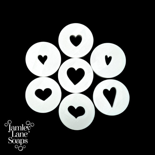 White heart-shaped discs arranged in a circular pattern on a black background, with 'Jamley Lane Soaps' branding.