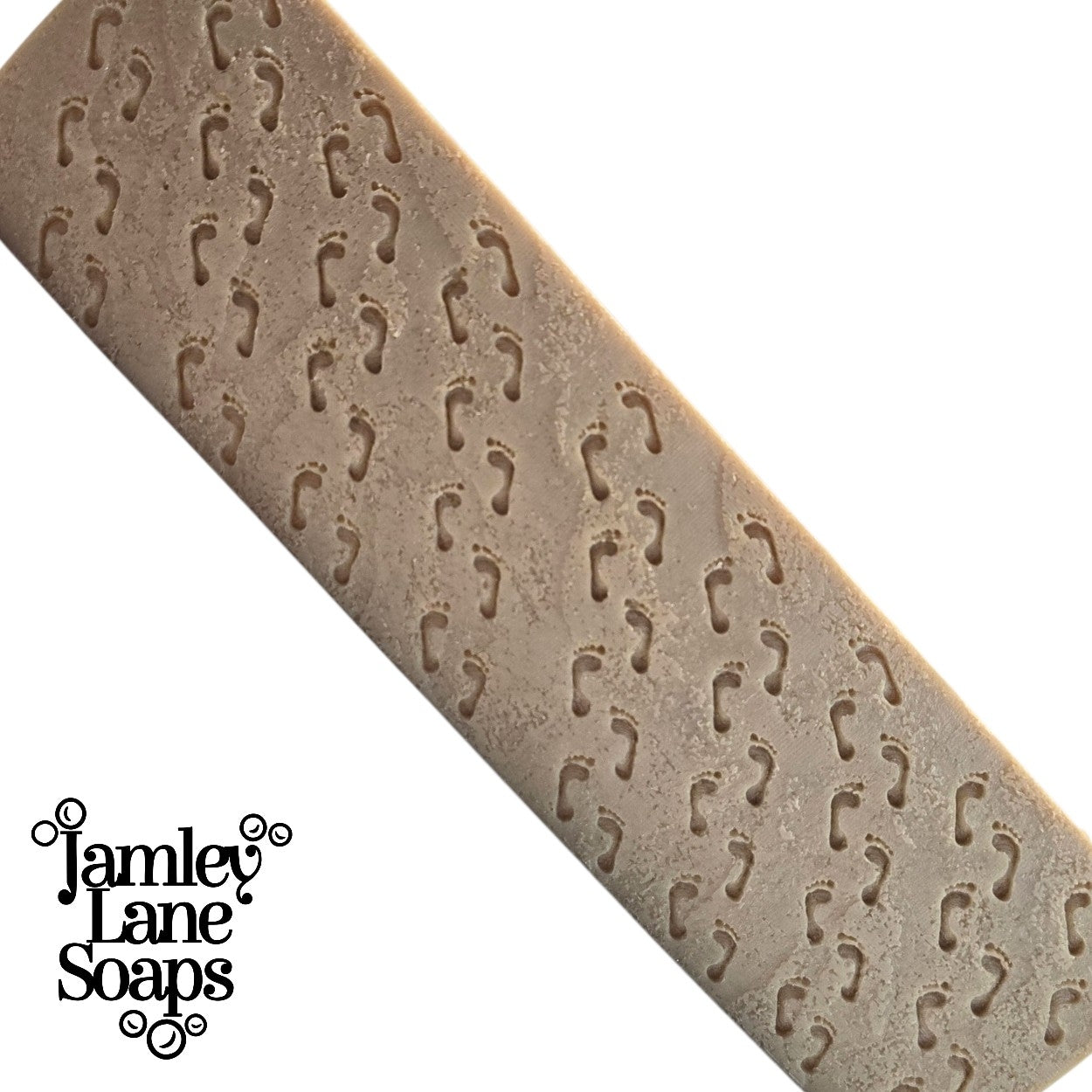 a full size loaf of soap featuring the debossed look as a result of using the impression mat featured in this listing. also shows 'Jamley Lane Soaps' branding on a white background