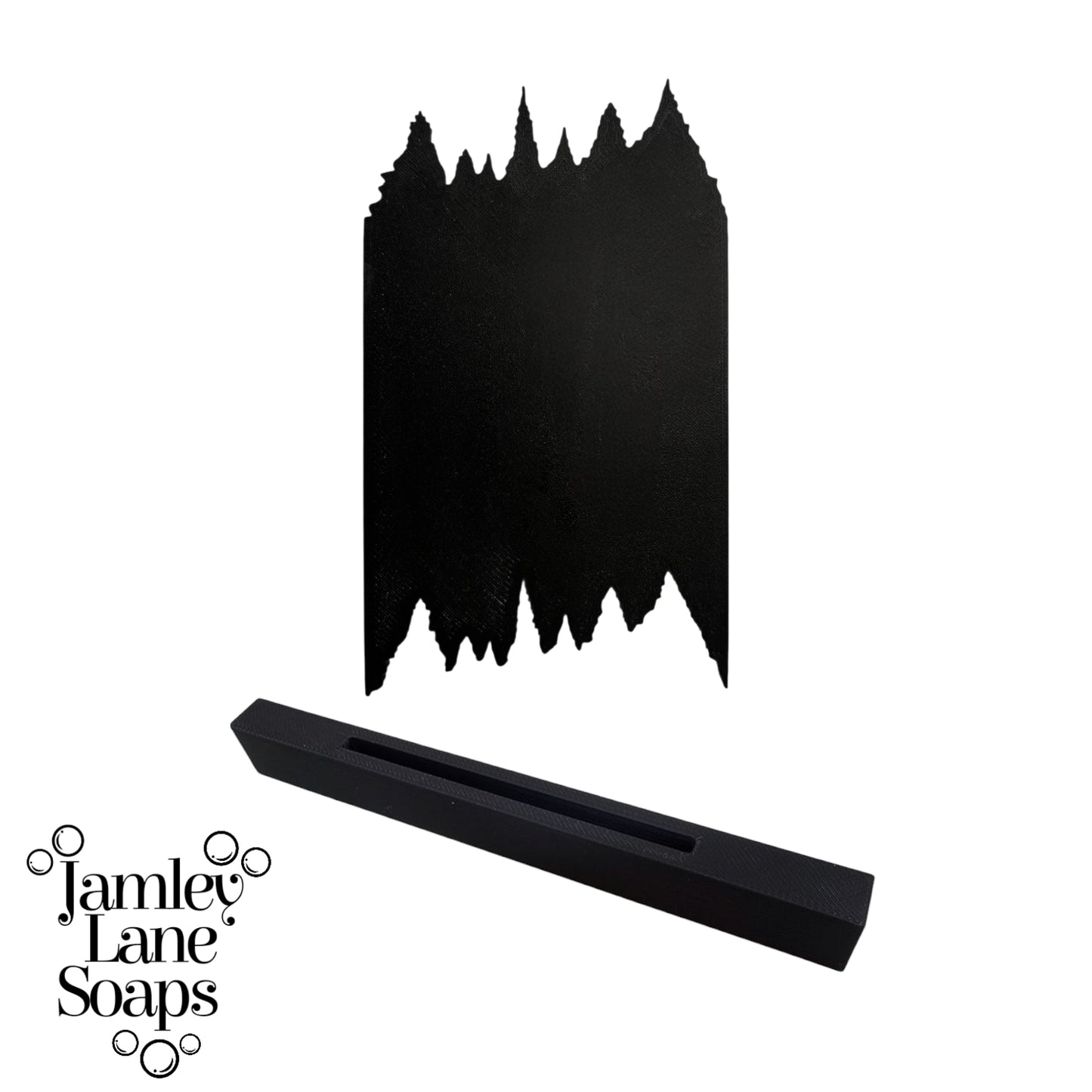 Black soap scraper in a tree line silhouette on a white background, featuring the brand 'Jamley Lane Soaps'.