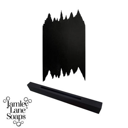Black soap scraper in a tree line silhouette on a white background, featuring the brand 'Jamley Lane Soaps'.