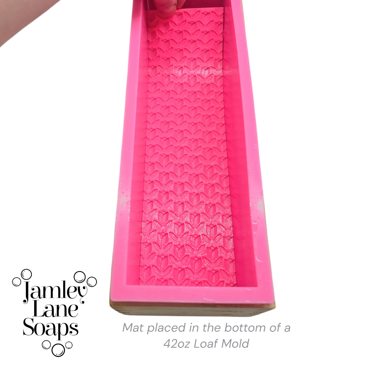 Pink artisan polymer mat placed in a generic Amazon 42oz loaf mold with Jamley Lane Soaps branding.
