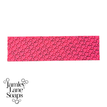 pink artisan polymer impression mat featuring anchors in a repeating pattern